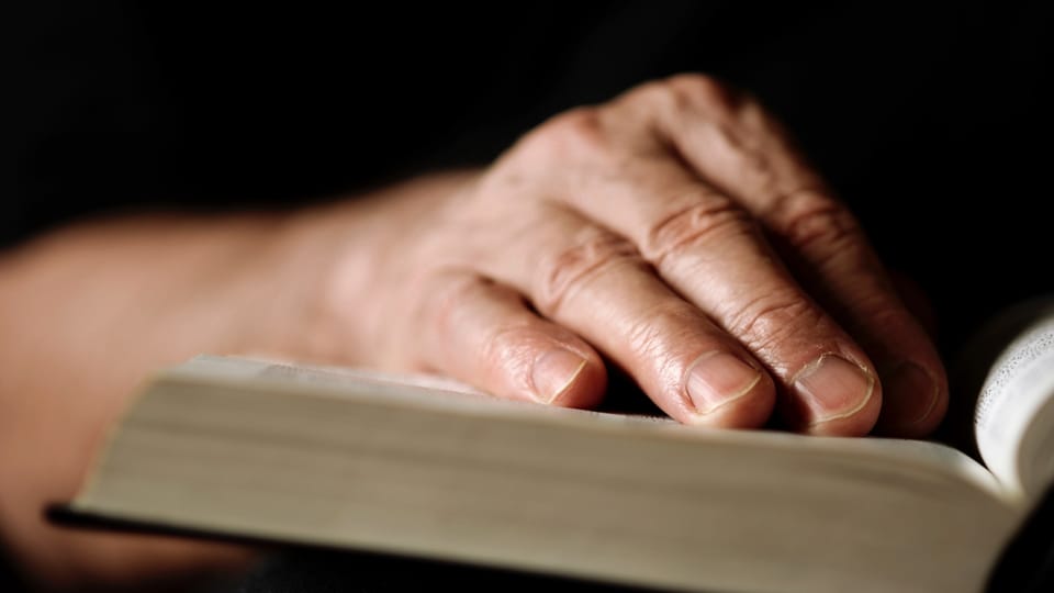 hand in Bible