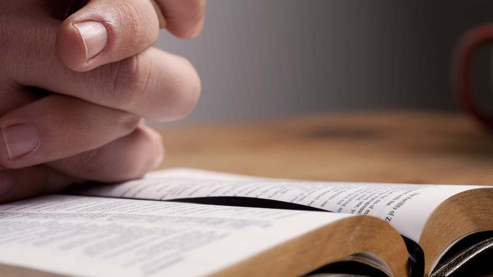 Reading Bible and praying