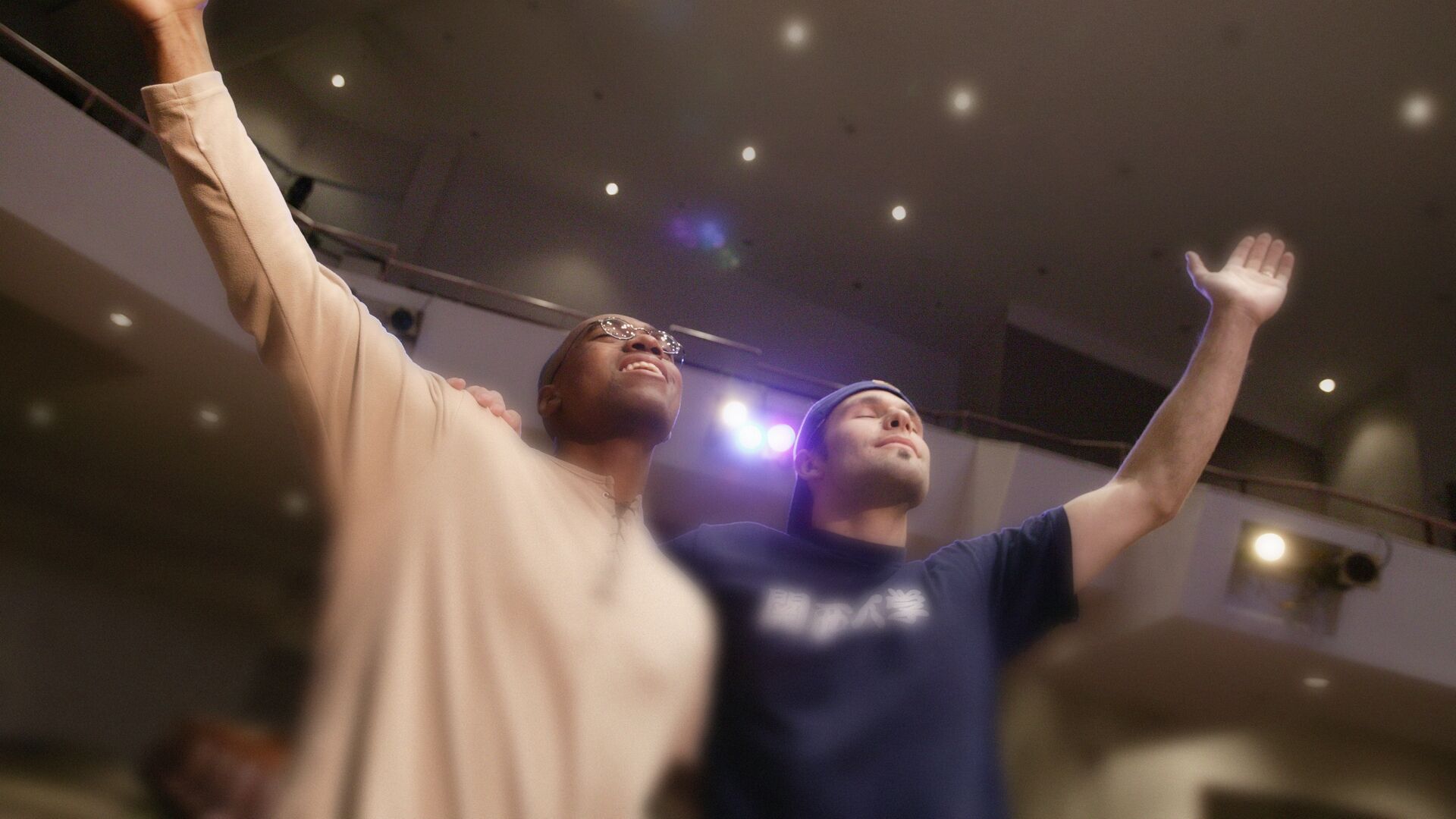 two men worshiping