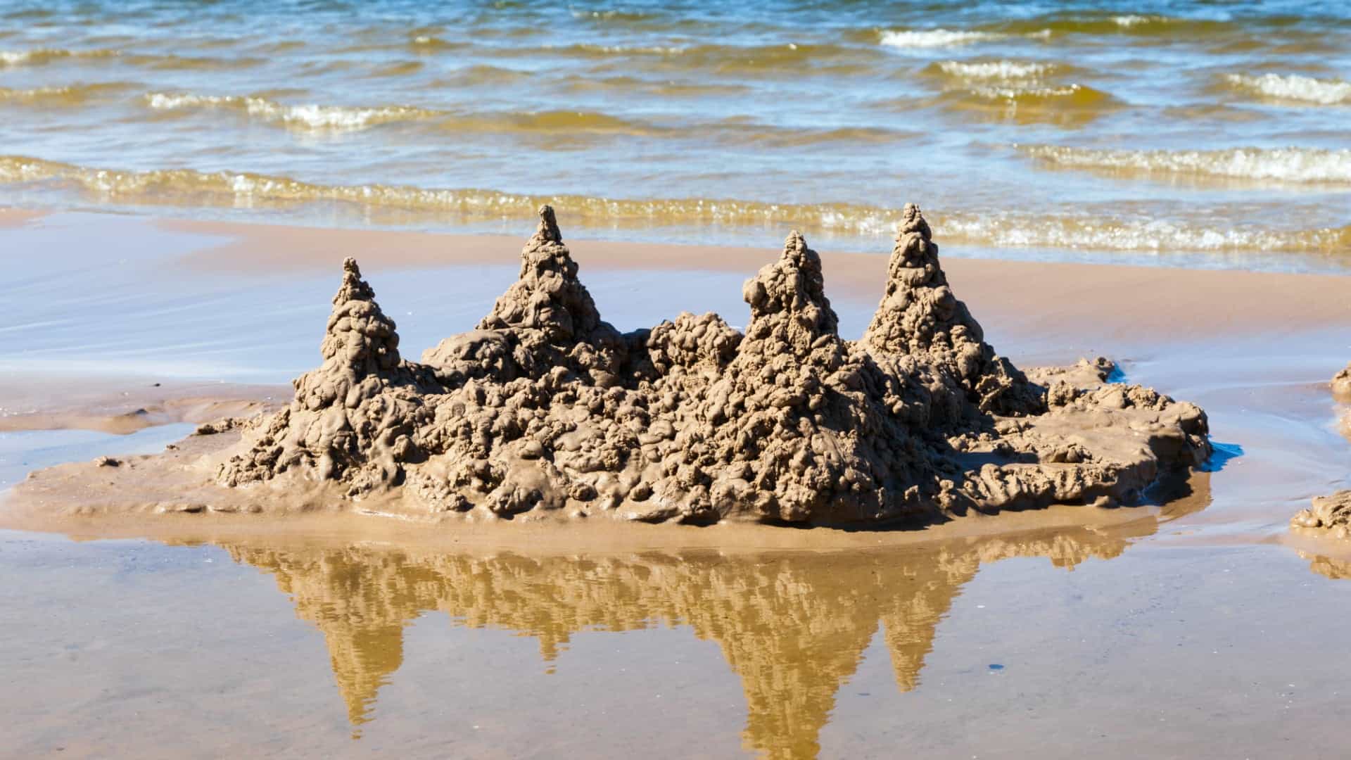 sand castle in waves